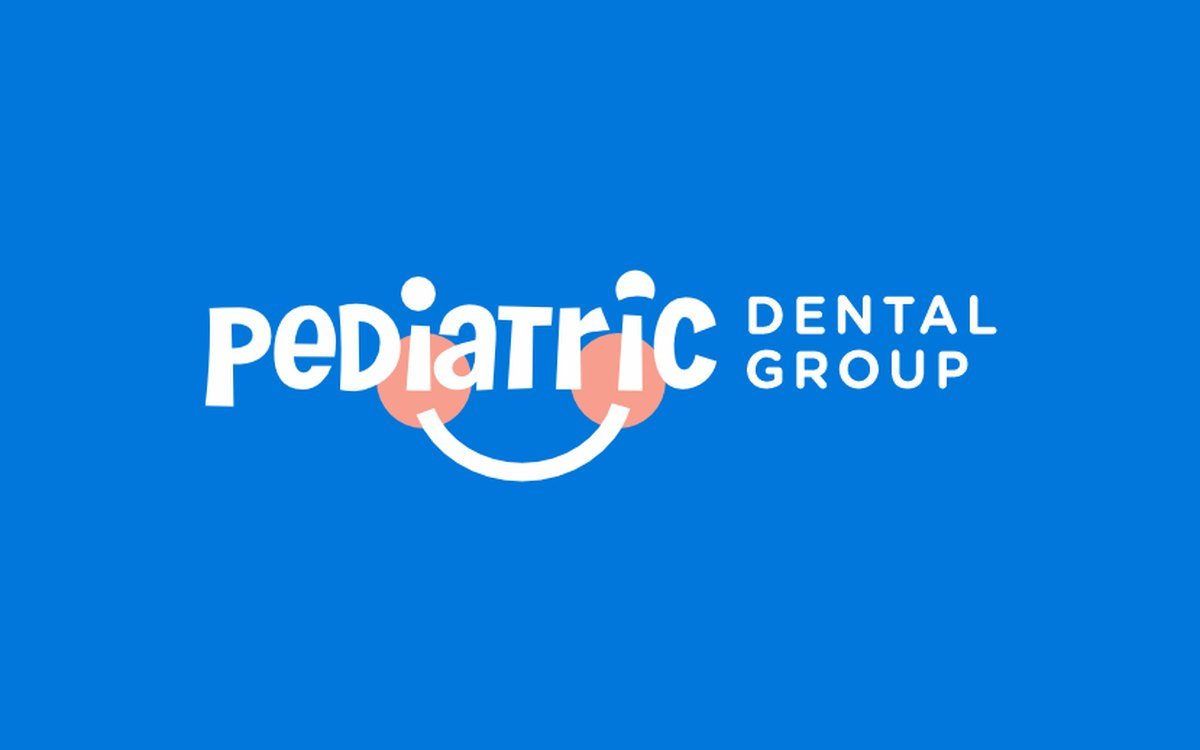 Pediatric Dental Group logo, a playful white wordmark with a smile and rosy cheeks underneath, on blue